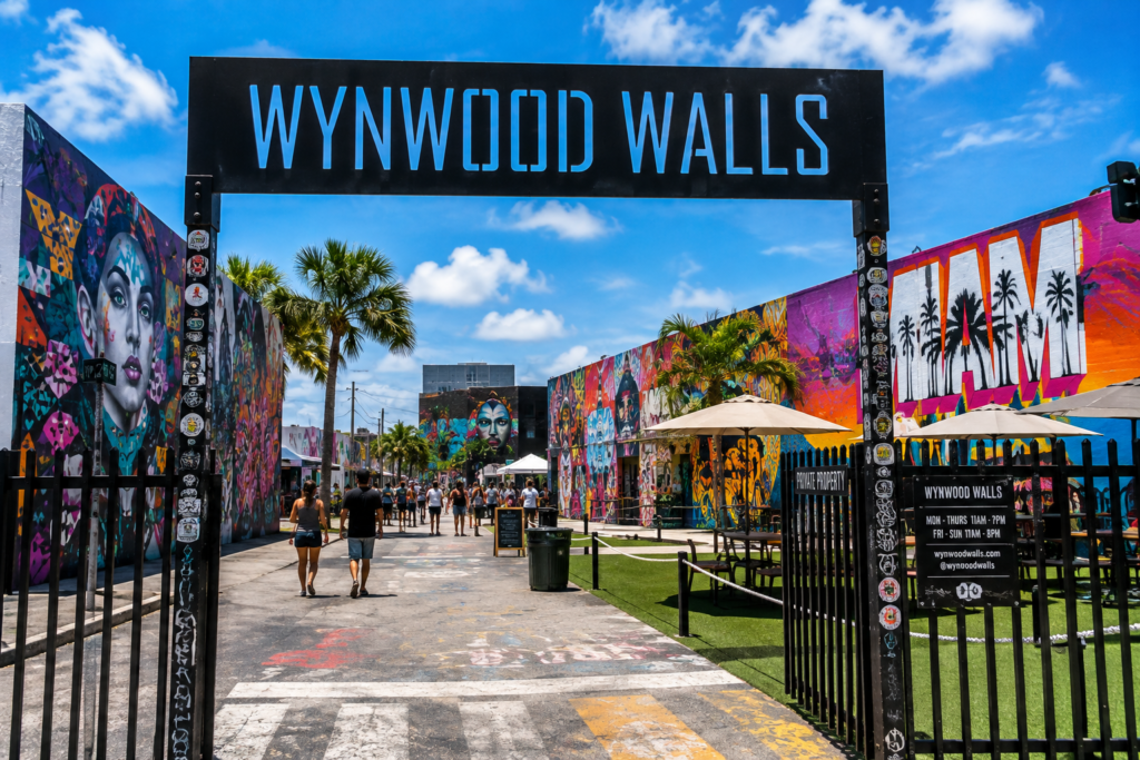 Wynwood Miami Florida with colorful street art, murals, palm trees, and visitors