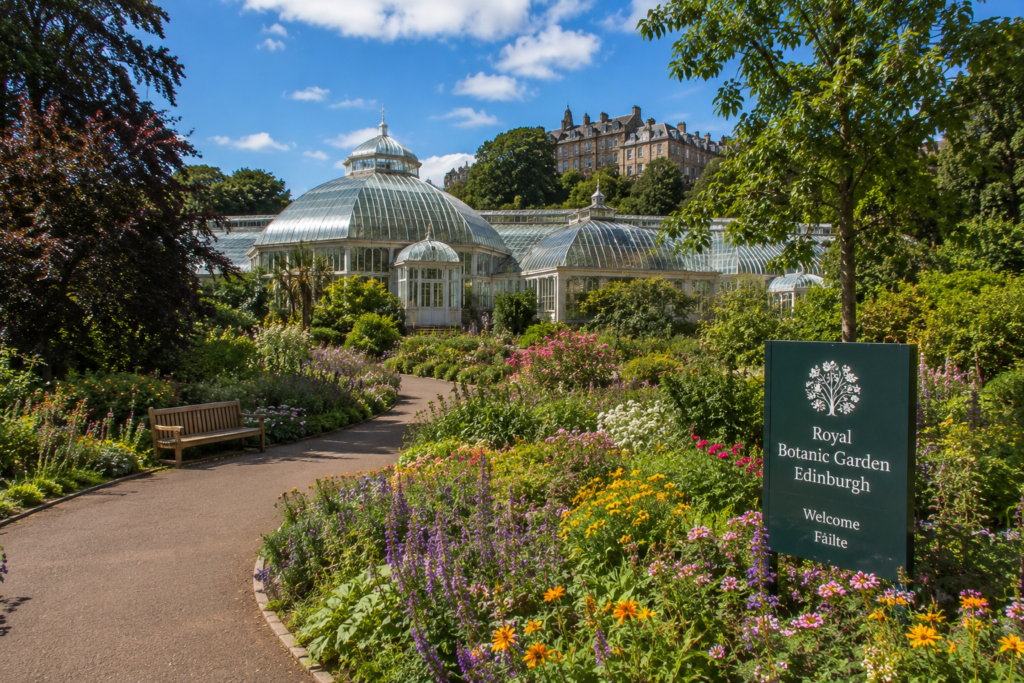Royal Botanic Garden Edinburgh UK with colorful flowers, lush greenery, glass conservatory, walking paths, and historic buildings