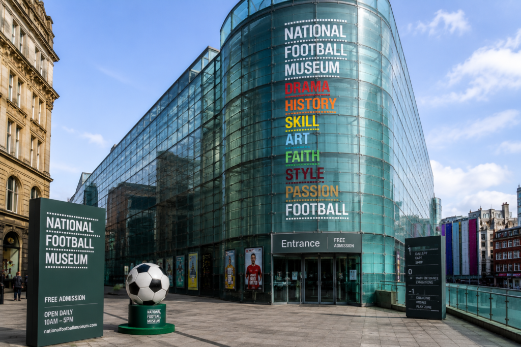 National Football Museum in Manchester UK with modern glass building, football displays, entrance, and city surroundings