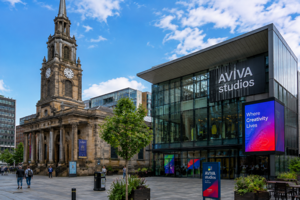 St John's and Aviva Studios in Manchester UK with historic church, modern glass building, public plaza, and visitors